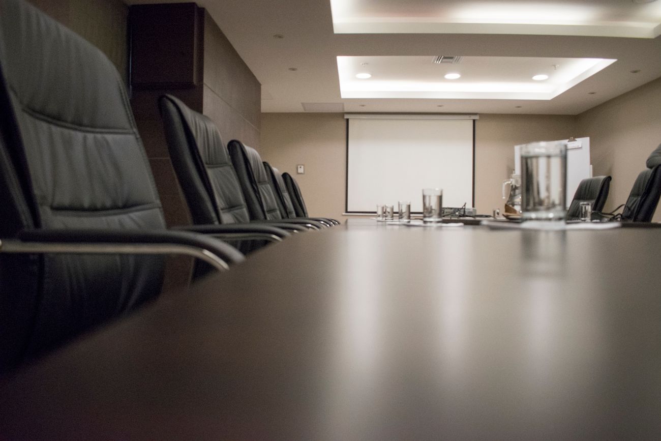 An empty boardroom set for a strategy session